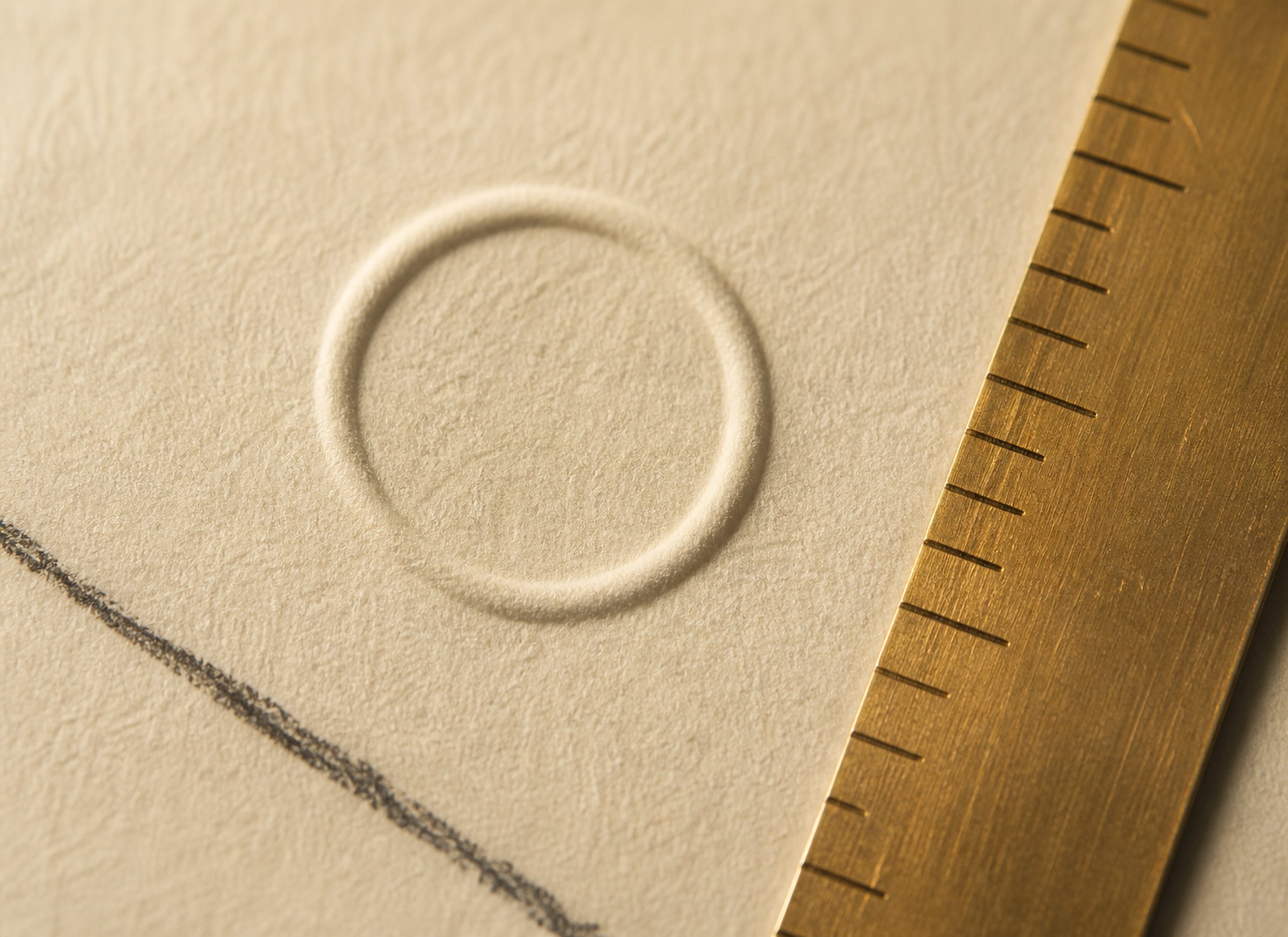 Project One, image 1. A quiet identity study — paper, mark and a little brass.