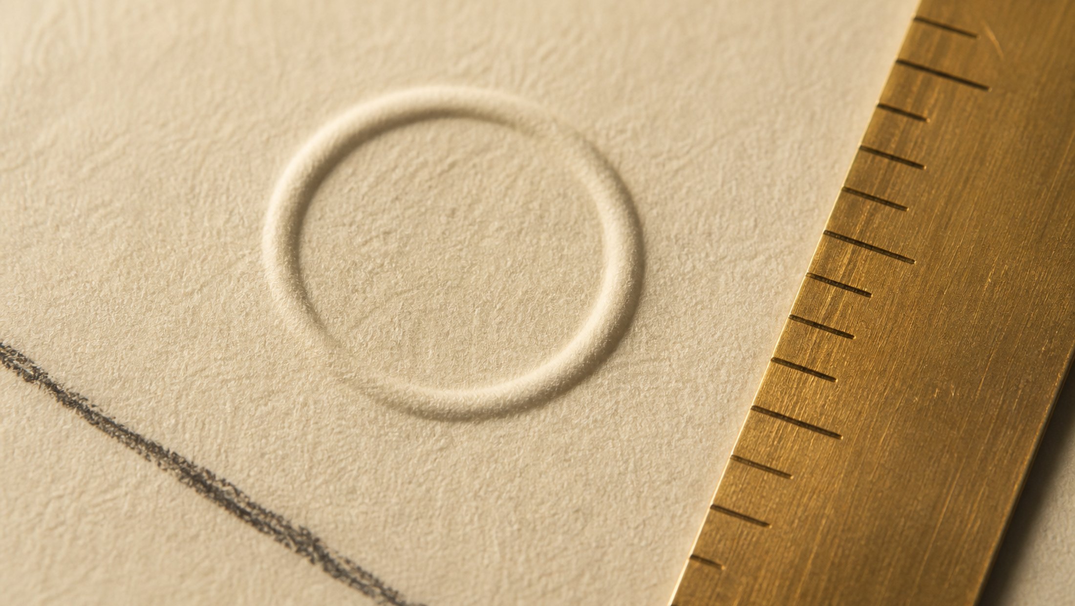 Project One, image 1. A quiet identity study — paper, mark and a little brass.